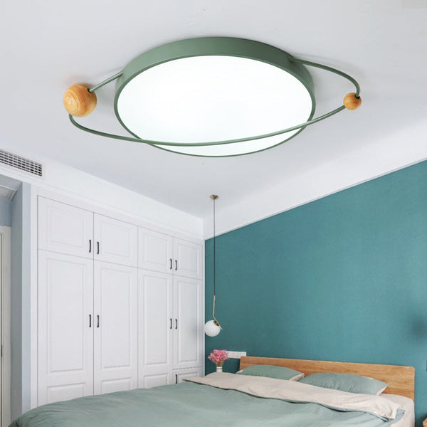 Ultra-thin LED ceiling light in children's room with green macaron design.