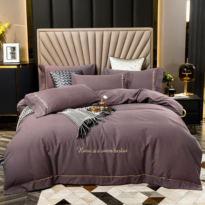 Brushed bedding set in European style with embroidered details on a 1.8m bed.